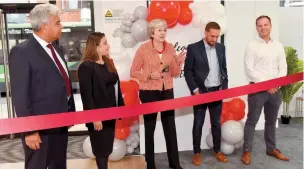  ?? ?? MP Theresa May cut the ribbon on Friday. 134981-58.