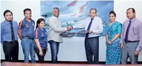  ??  ?? Foundation of Goodness Founder/chief Trustee Kushil Gunasekera and Srilankan Airlines Chairman Ajith Dias exchange MOU documents in the presence of (from left) Srilankan Airlines Srilankan Cares Manager Niroshan Ranawake, Foundation of Goodness...