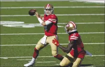  ?? ADAM HUNGER — THE ASSOCIATED PRESS ?? San Francisco 49ers quarterbac­k Nick Mullens (4) in action against the Jets during their game last Sunday in East Rutherford, N.J.