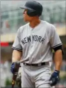  ?? THE ASSOCIATED PRESS ?? Yankees right fielder Aaron Judge returns to the dugout after striking out against the Minnesota Twins in the ninth inning.