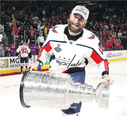  ?? — GETTY IMAGES ?? Former Prince George junior star Brett Connolly hoists the Stanley Cup after the Washington Capitals defeated the Golden Knights 4-3 in Game 5 of the NHL final in Las Vegas earlier this month.