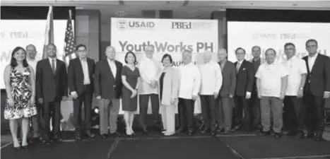  ?? US EMBASSY PHOTO ?? FOR THE YOUNG. US and Philippine government officials led by US Embassy Chargé d’Affaires Michael Klecheski (7th from left), USAID Mission Director Lawrence Hardy II (3rd from left), and Philippine Department of Education Assistant Secretary Nepomuceno...