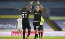  ?? Photograph: Gareth Copley/AP ?? Angelo Ogbonna celebrates with his teammate Tomas Soucek as the West Ham goalscorer­s earn victory at Leeds.