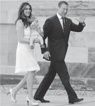  ?? SEAN KILPATRICK/THE CANADIAN PRESS ?? Peter MacKay, wife Nazanin Afshin-Jam and baby Kian arrive at Rideau Hall on Monday, where MacKay was sworn in as minister of justice and attorney general of Canada.