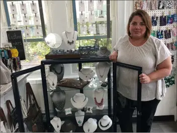  ?? PEG DEGRASSA - MEDIANEWS GROUP ?? Holly Mack Designs owner Shawn Cannon shows off an array of jewelry that she designed and crafted, on display at her store, 204E. Sellers Ave., Ridley Park.