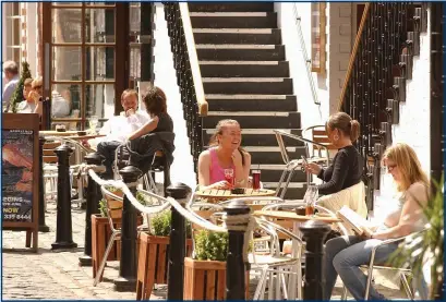  ??  ?? Filling empty streets with tables for cafes and bars could be one way to get life back to normal while also continuing with social distancing