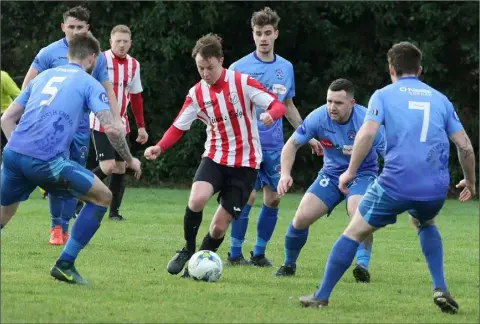  ??  ?? Shane Franklin of Bunclody is outnumbere­d by North End United players.