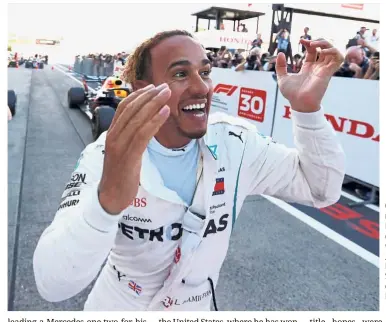  ??  ?? One happy man: Mercedes’ Lewis Hamilton celebratin­g after winning the Japanese Grand Prix at the Suzuka Circuit on Sunday. — Reuters