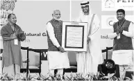  ?? PHOTO: PTI ?? PM Narendra Modi with ADNOC CEO Sultan Ahmed Al Jaber, Uttar Pradesh CM Yogi Adityanath and oil and gas minister Dharmendra Pradhan at the Petrotech 2019 in Greater Noida