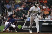  ?? ERIC CHRISTIAN SMITH — THE ASSOCIATED PRESS ?? The A’s Seth Brown watches his two-run home run during the ninth inning against the Houston Astros on Sunday.