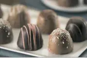  ?? Betsy Ann Chocolates ?? Betsy Ann Chocolates sells an upscale box of 8 American Original Chocolate Truffles for $24.99.