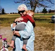  ??  ?? Marie Trittschuh hugs her 2-year-old great-grandson Harper Kosicki last weekend. They haven’t seen each other throughout the pandemic except for the two funerals of Trittschuh’s children, Harper’s grandma and great-uncle who died from COVID-19.