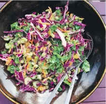  ??  ?? This colourful red cabbage and kale slaw is strewn with pumpkin seeds and raisins and goes well with barbecued ham.