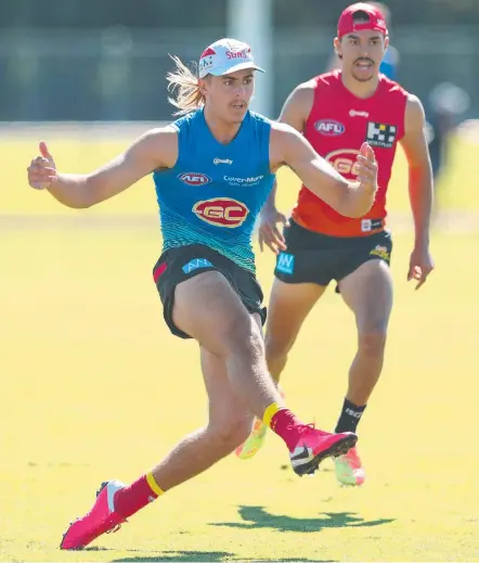  ?? Picture: CHRIS HYDE/GETTY IMAGES ?? Jeremy Sharp kicks during a Gold Coast Suns training session.