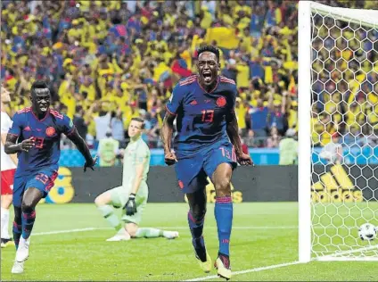  ?? FOTO: GETTY ?? Mina celebra su gol de cabeza ante Polonia El Barça valora que su cotización sube y no olvida que el Tottenham pagó 45 por Davinson