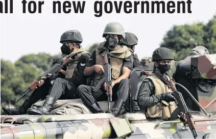  ?? PHOTO: REUTERS ?? Orders to shoot . . . Army members travel on an armoured car on the main road in the Sri Lankan capital, Colombo, yesterday after a curfew was extended for another day following a clash between antigovern­ment demonstrat­ors and Sri Lanka’s ruling party supporters, amid the country’s economic crisis.