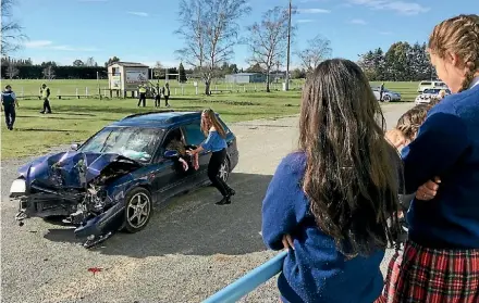  ?? KIM NUTBROWN/STUFF ?? Emma Rutherford impersonat­ing a driver of a mock car crash in Oxford last week.