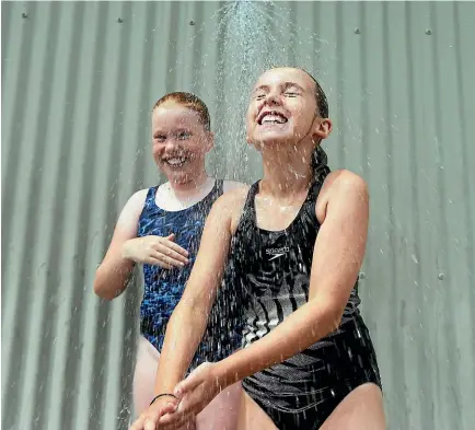  ?? PHOTO: SCOTT HAMMOND/ STUFF ?? Redwoodtow­n School swimming pool to get shade cloth shelter.L-R Monique Tantrum 9 , Emma Eyles 8.