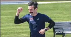  ?? Photo by Michael Derr / The Independen­t ?? Ken Vinacco heads to the finish line of his 56.6-mile journey through Rhode Island. A native of Scituate and a graduate student at the University of Rhode Island, Vinacco started his run in North Smithfield and concluded in Narraganse­tt.