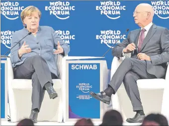  ??  ?? La canciller alemana, Ángela Merkel, junto al fundador del Foro de Davos, Klaus Schwab. La líder insistió en la búsqueda de acciones multilater­ales a los problemas mundiales.