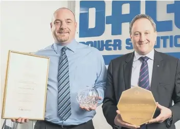  ??  ?? Dale Power Solutions business support manager Mark Carter and chief executive Tim Wilkins with the award.