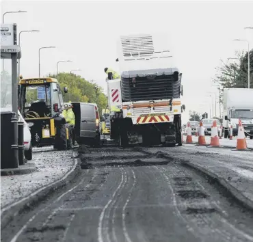  ?? ?? Resurfacin­g work and filling of potholes could be affected by bitumen supply problems