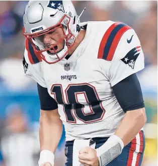  ?? ADAM HUNGER/AP ?? Patriots quarterbac­k Mac Jones reacts to a play against the Giants during a preseason game Sunday in East Rutherford, N.J. Jones will be the starting QB for the Patriots in the Sept. 12 opener vs. Miami.