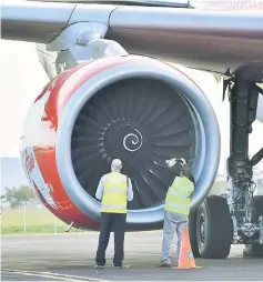  ??  ?? Officials inspect an engine of Malaysian budget carrier AirAsia X Flight D7207 after it was diverted and forced to land because an engine was damaged during take-off by what was thought to be a bird strike at Brisbane Airport in Australia. — Reuters...