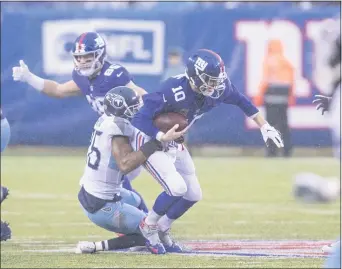  ?? JOHN BLAINE — FOR THE TRENTONIAN ?? Logan Ryan, seen here sacking former Giants quarterbac­k Eli Manning during a 2018 game with the Tennessee Titans at MetLife Stadium, has signed a one-year deal with the Giants.