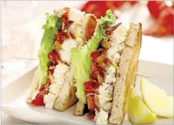  ?? MICHAEL TERCHA / CHICAGO TRIBUNE ?? Take the perfect sandwich even further: Add lobster. This BLT variation from “Soup Nights,” by Betty Rosbottom, dresses lobster chunks in a lemon zest and tarragon mayo.