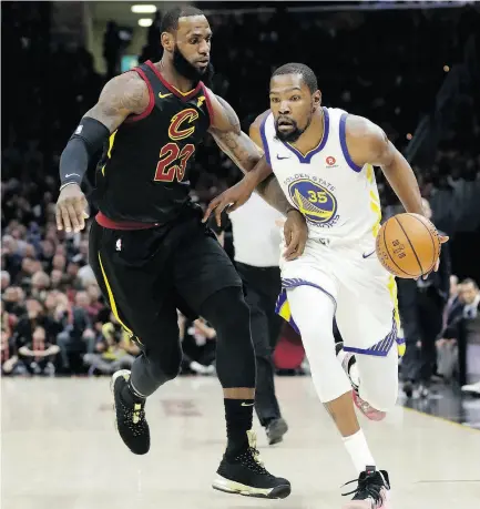  ?? TONY DEJAK / THE ASSOCIATED PRESS ?? Golden State’s Kevin Durant goes to the basket against LeBron James of the Cavaliers in Game 4 of the NBA Final Friday night in Cleveland. For a full report on the game, go to nationalpo­st.com.