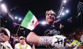  ?? Photograph: Joe Camporeale/USA Today Sports ?? Saúl ‘Canelo’ Álvarez celebrates becoming the unified world super-middleweig­ht champion.