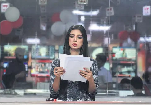  ??  ?? Pakistan’s first transgende­r news anchor Marvia Malik, 21, prepares before reading the news on air for private channel Kohenoor in Lahore.