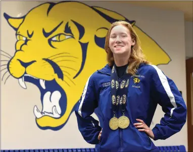  ?? PETE BANNAN - DAILY LOCAL ?? Downingtow­n East’s Alexa Fulton with her Stae Championsh­ip metals.