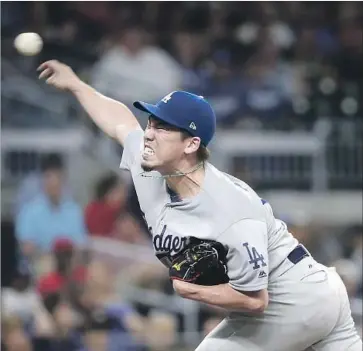  ?? John Bazemore Associated Press ?? KENTA MAEDA delivered one of his strongest outings of the season Tuesday night in a 3-2 victory over the Atlanta Braves, giving up two hits in seven scoreless innings and striking out six.