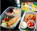  ?? PHOTO: FAIRFAX MEDIA ?? Children enjoy a bite sized lunch in compartmen­ts.