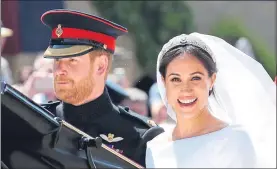  ??  ?? Meghan smiles for the cameras as they leave in a carriage