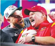  ?? The Associated Press ?? ■ Kansas City Chiefs head coach Andy Reid, right, and Travis Kelce (87) celebrate their win after the NFL Super Bowl 57 football game, Sunday, in Glendale, Ariz. The Chiefs defeated the Philadelph­ia Eagles 38-35