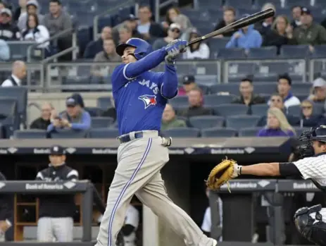  ?? BILL KOSTROUN/THE ASSOCIATED PRESS ?? Steve Pearce picked up where he left off the night before, with a first-inning homer. off C.C. Sabathia. The Jays, however, couldn’t hold their early lead.