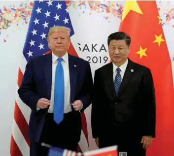  ?? FILE PHOTO: ?? US President Donald Trump and China’s President Xi Jinping pose for a photo ahead of their bilateral meeting during the G20 leaders summit in Osaka, Japan, June 29, 2019.