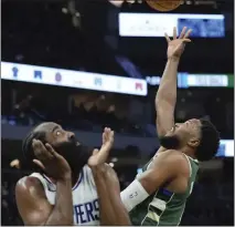  ?? MORRY GASH — THE ASSOCIATED PRESS ?? The Bucks' Malik Beasley shoots over the Clippers' James Harden during Monday's game in Milwaukee. The Clippers lost 113-106.
BSSC