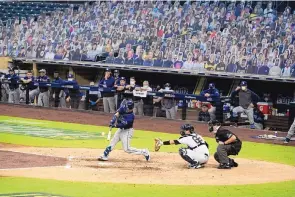  ?? GREGORY BULL/ASSOCIATED PRESS ?? Tampa Bay’s Michael Perez hits a two-run homer in the sixth inning to extend the Rays’ lead against the Yankees on Wednesday night.