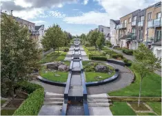  ??  ?? Clockwise from above: The courtyard and exteriors of Waterside at Malahide; the dining area overlookin­g the kitchen and the reception area