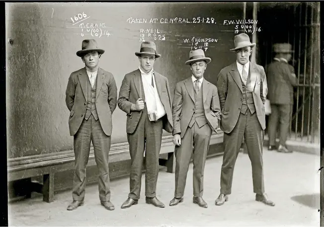  ?? PHOTOS: NSW FORENSIC ARCHIVES ?? A group mugshot taken on January 25, 1928 at the Central Police Station in Sydney shows Thomas Craig, Raymond Neil (aka ‘‘Gaffney the Gunman’’), William Thompson and FW Wilson. The photograph was apparently taken in the aftermath of a raid led by CIB...