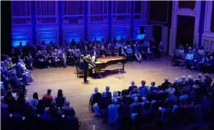  ?? Sebastian Foltz/Post-Gazette ?? Pittsburgh Symphony Orchestra violinist David McCarroll performs a solo during PSO 360: Violins of Hope in October 2023.