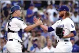  ?? MARK J. TERRILL — THE ASSOCIATED PRESS ?? Dodgers catcher Will Smith and relief pitcher Craig Kimbrel celebrate after beating the Padres, 4-0, on Aug. 7 in Los Angeles.