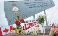  ?? ANDREW VAUGHAN THE CANADIAN PRESS ?? A memorial at 12 Wing Shearwater in Dartmouth, N.S., pays respect to the victims of the military helicopter crash.