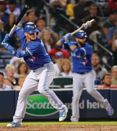  ?? CURTIS COMPTON/TNS ?? The Jays’ Josh Donaldson, left, and Jose Bautista were quiet Tuesday, going a combined 0-for-8 against the Braves.