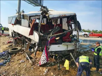  ?? AP PHOTO ?? In this Aug. 2, 2016 file photo, authoritie­s investigat­e the scene of a charter bus crash on northbound State Route 99 between Atwater and Livingston in California’s Central Valley.