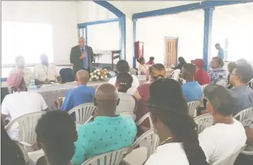  ??  ?? Minister of Natural Resources Raphael Trotman addressing participan­ts at the lottery draw.